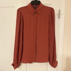 Express Size M Burnt orange long sleeved button down top. NWOT